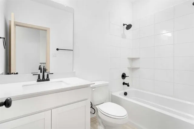 a bathroom with a sink a toilet and a bathtub