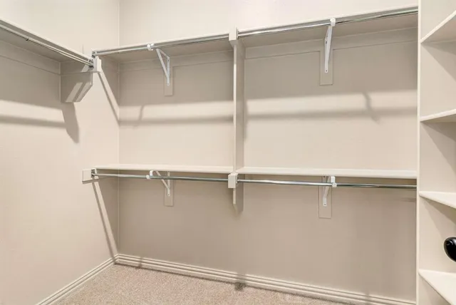 a view of an empty walk in closet