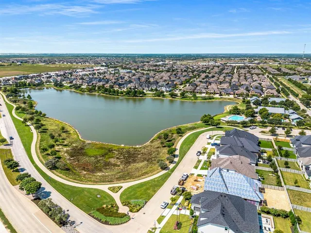 an aerial view of a house with a ocean view