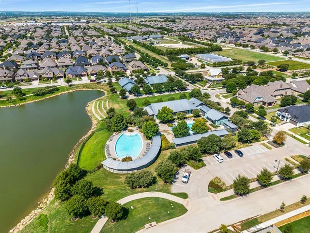 an aerial view of a house with a swimming pool yard and outdoor seating