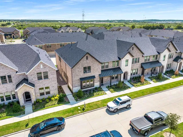 an aerial view of a house with swimming pool