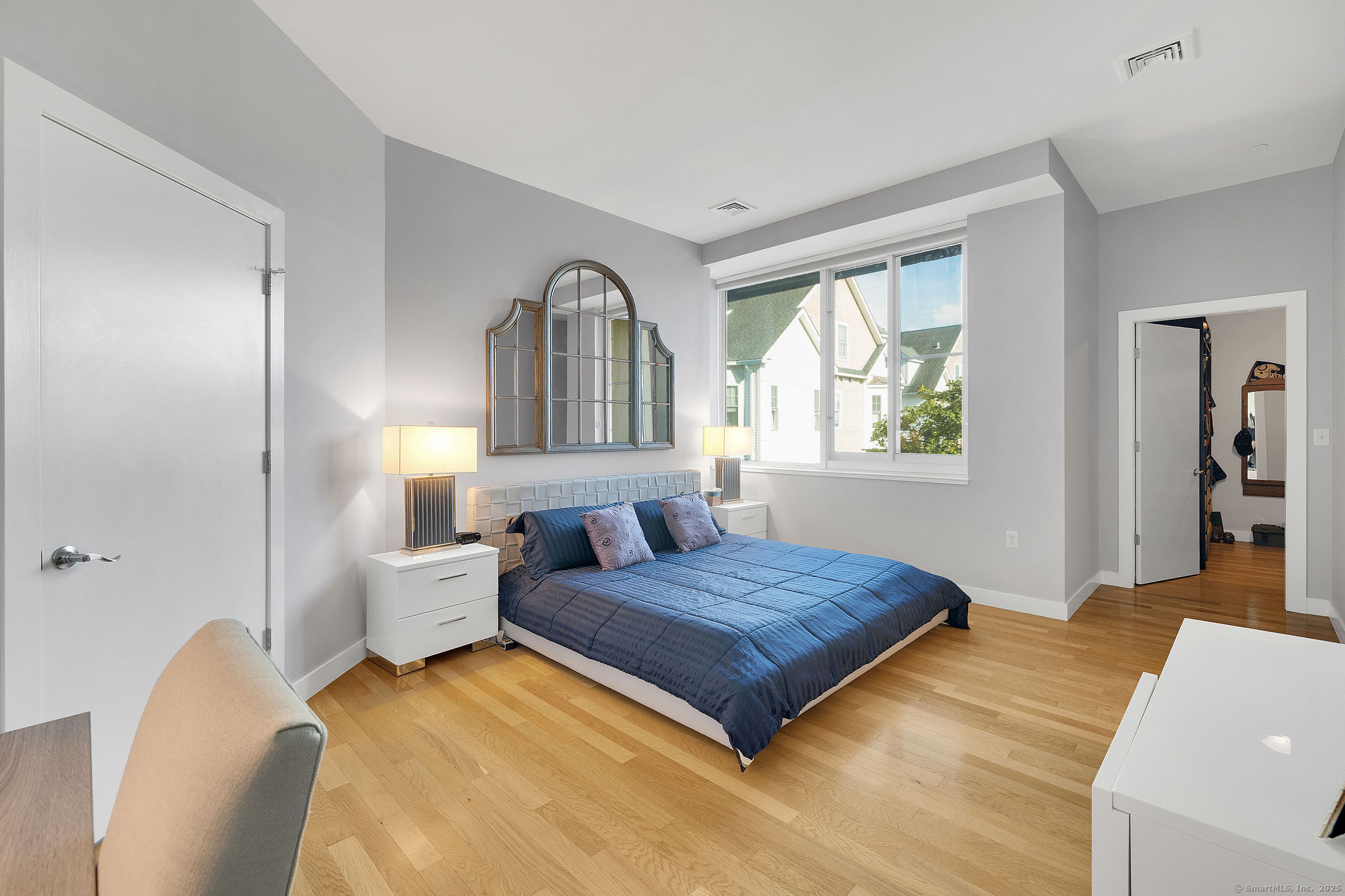 1515 Summer Street, Unit 302 Stamford, CT 06905 - Photo 12 of 33 a bedroom with a large bed and a window