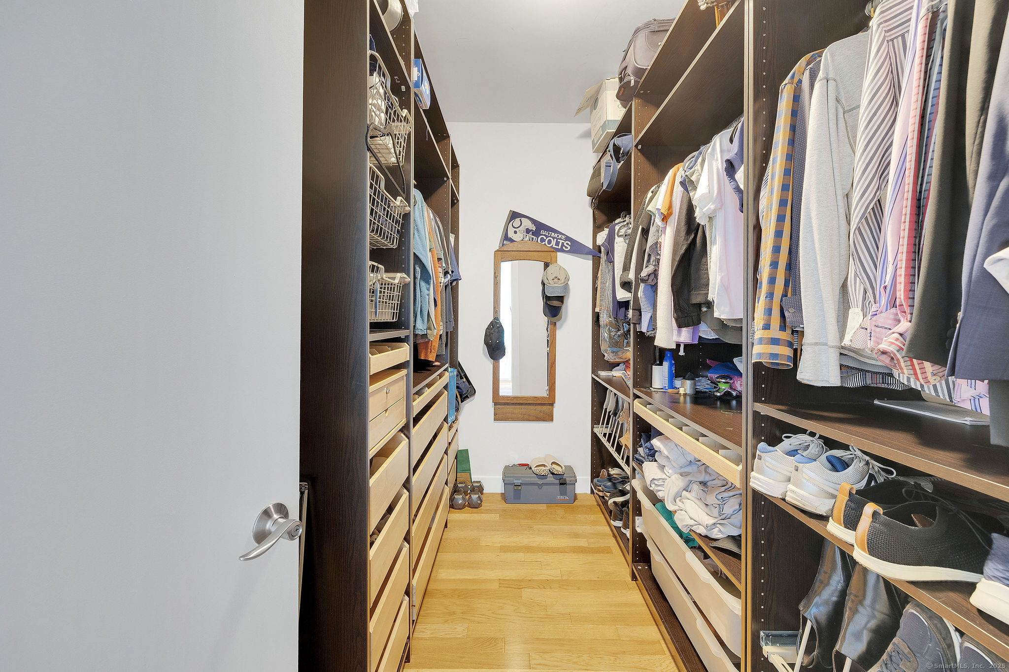 1515 Summer Street, Unit 302 Stamford, CT 06905 - Photo 14 of 33 walk in closet with wooden floor