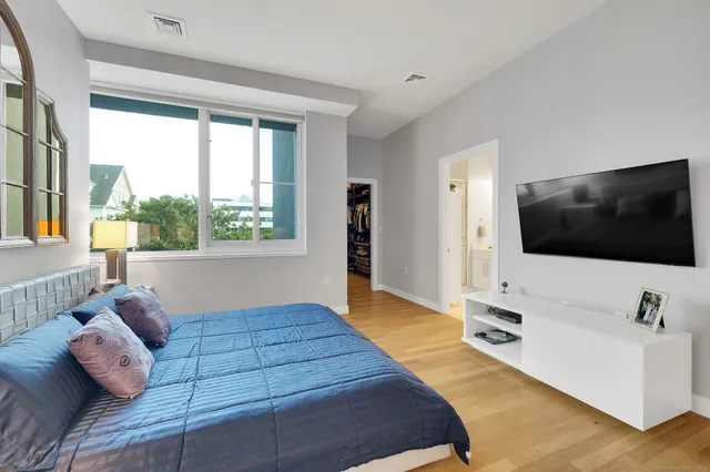 a view of a workspace with furniture and windows