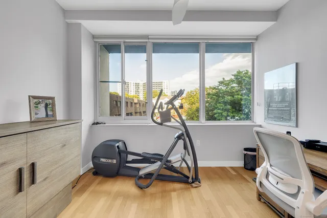 a room with a bed and cabinets