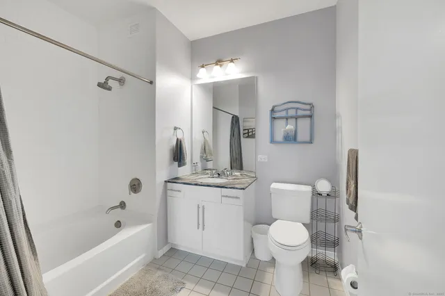 a view of a bathroom with wooden floor