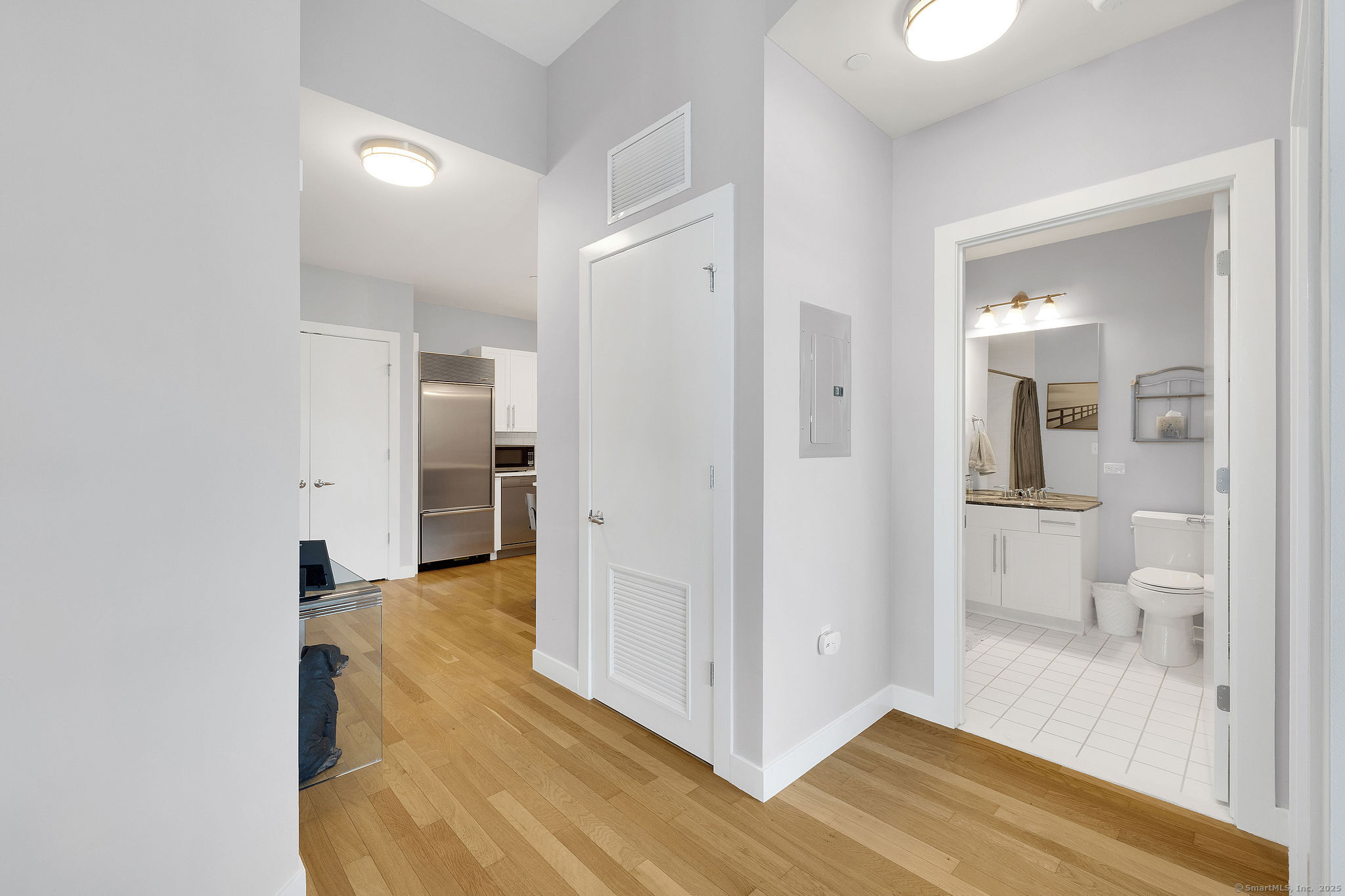 1515 Summer Street, Unit 302 Stamford, CT 06905 - Photo 23 of 33 a view of a bathroom with wooden floor