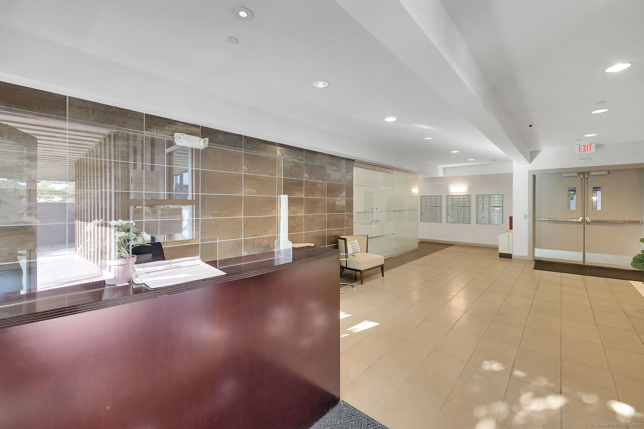 1515 Summer Street, Unit 302 Stamford, CT 06905 - Photo 26 of 33 a view of empty room with wooden floor and windows