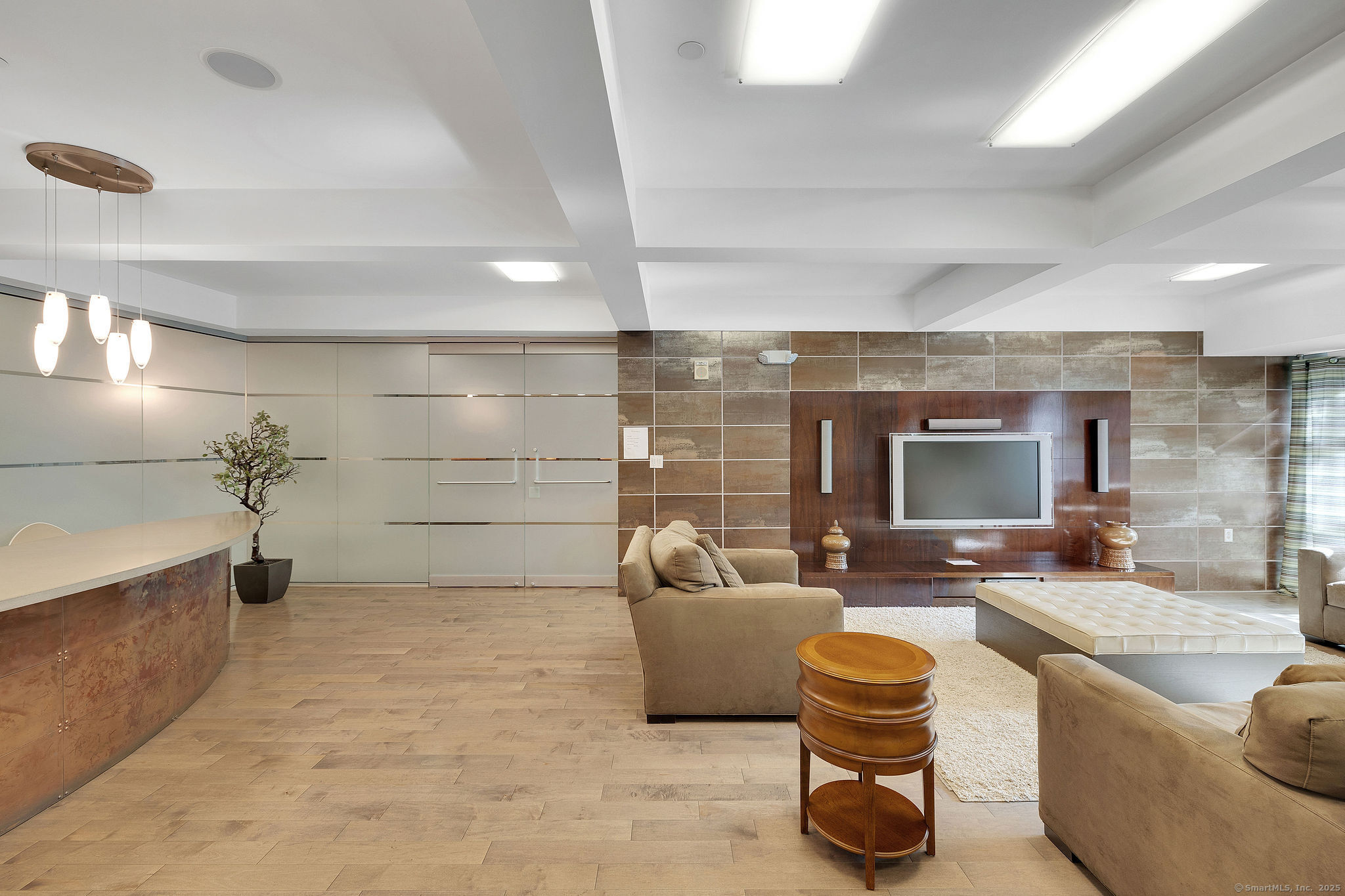 1515 Summer Street, Unit 302 Stamford, CT 06905 - Photo 29 of 33 a living room with furniture and a flat screen tv