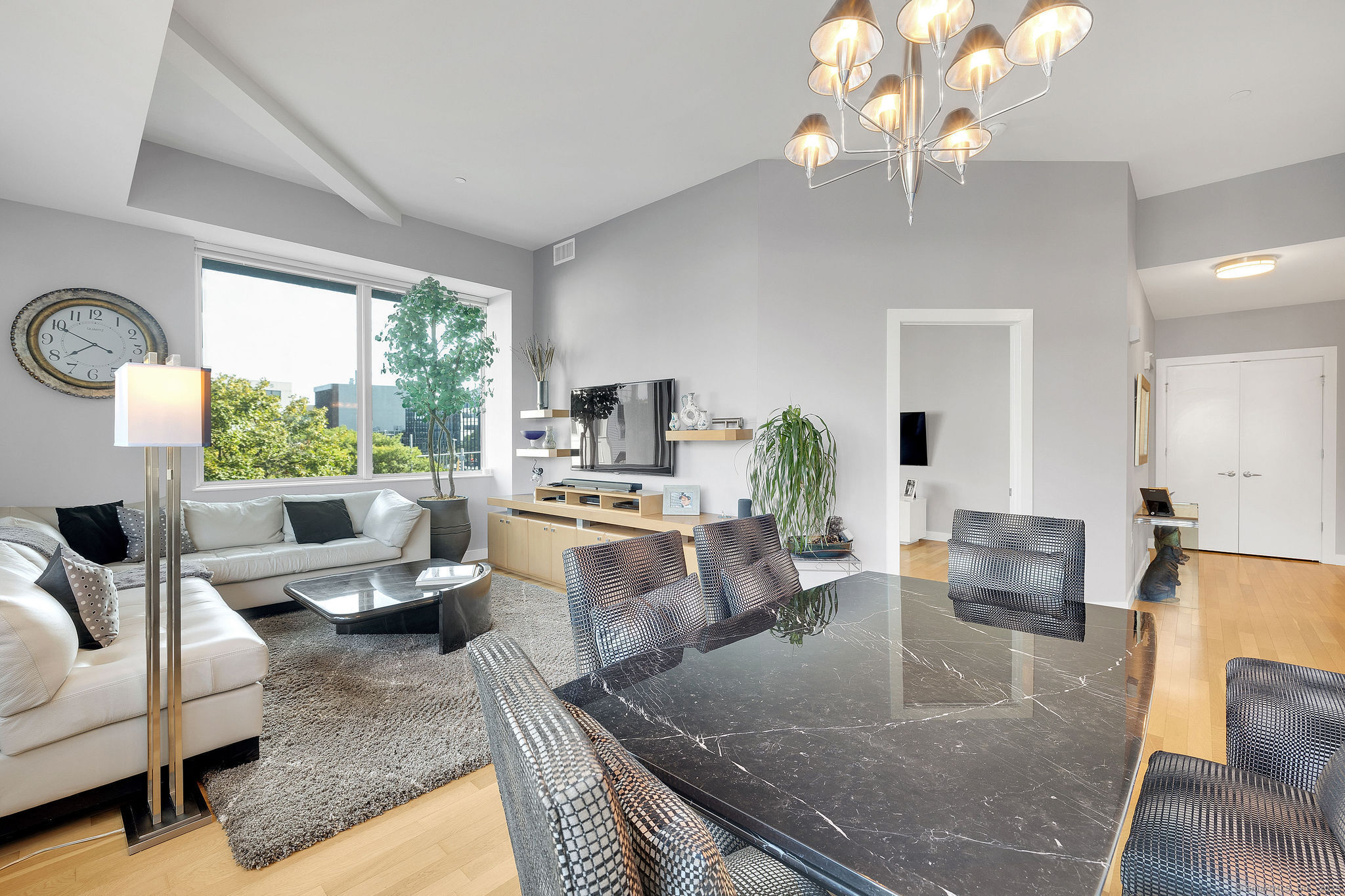 1515 Summer Street, Unit 302 Stamford, CT 06905 - Photo 8 of 33 a living room with fireplace furniture and a large window