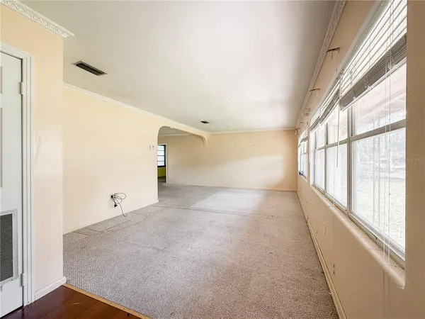 a view of an empty room with a window