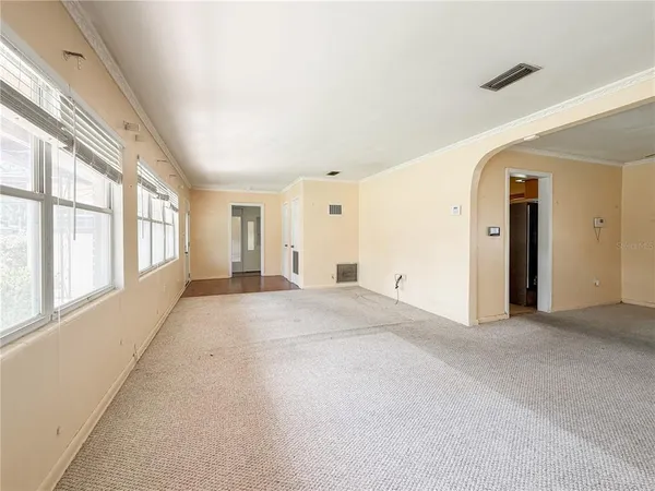 a view of an empty room with a window