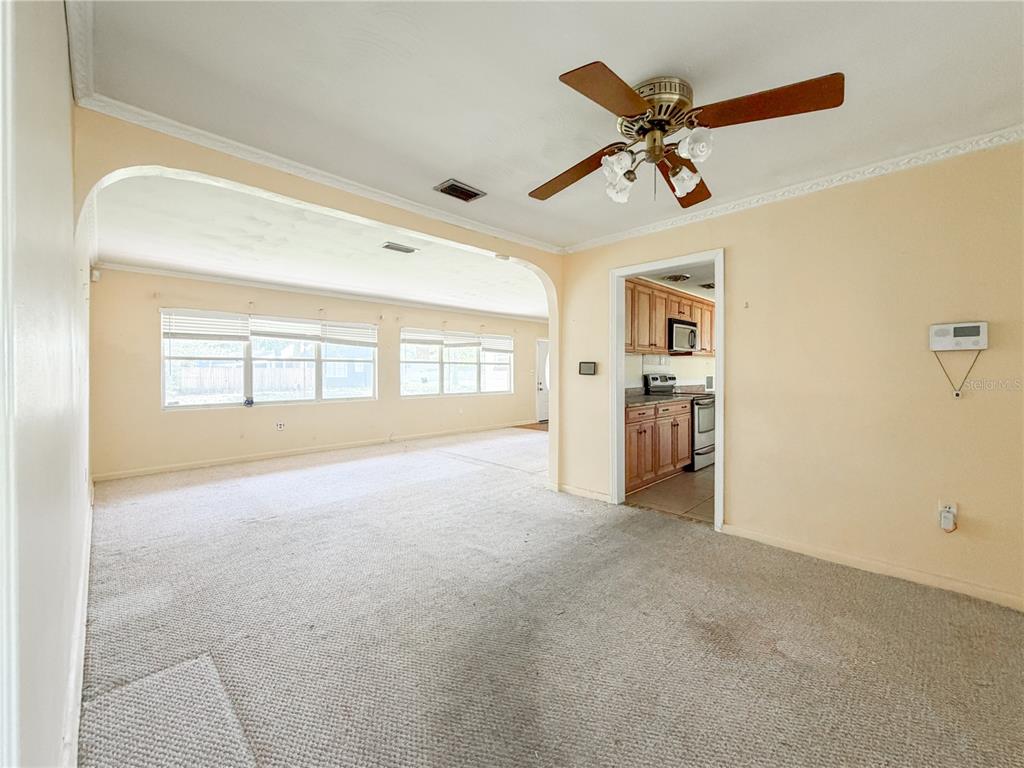 615 North Church Street Starke, FL 32091 - Photo 21 of 44 a view of a livingroom with a ceiling fan and window