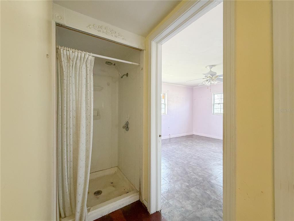 615 North Church Street Starke, FL 32091 - Photo 29 of 44 a view of a bathroom with a glass shower door