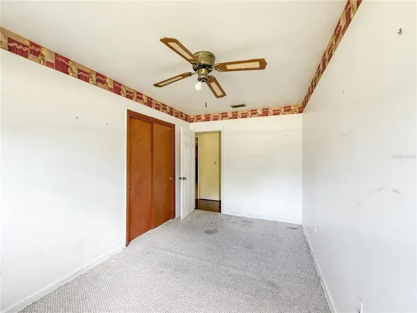 a view of room with ceiling fan