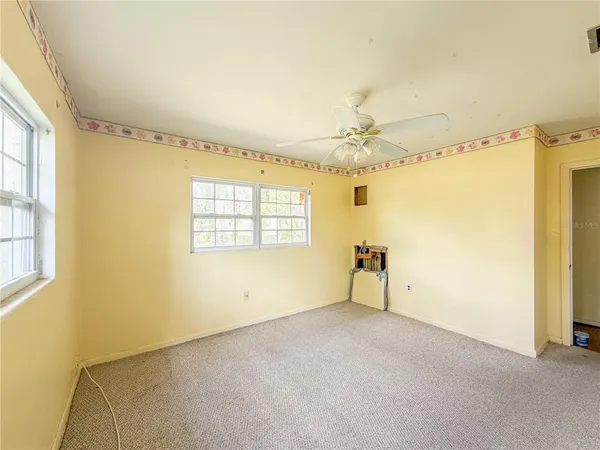 a view of an empty room with a window