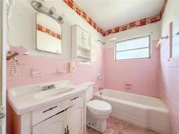 a bathroom with a sink a toilet and a bathtub