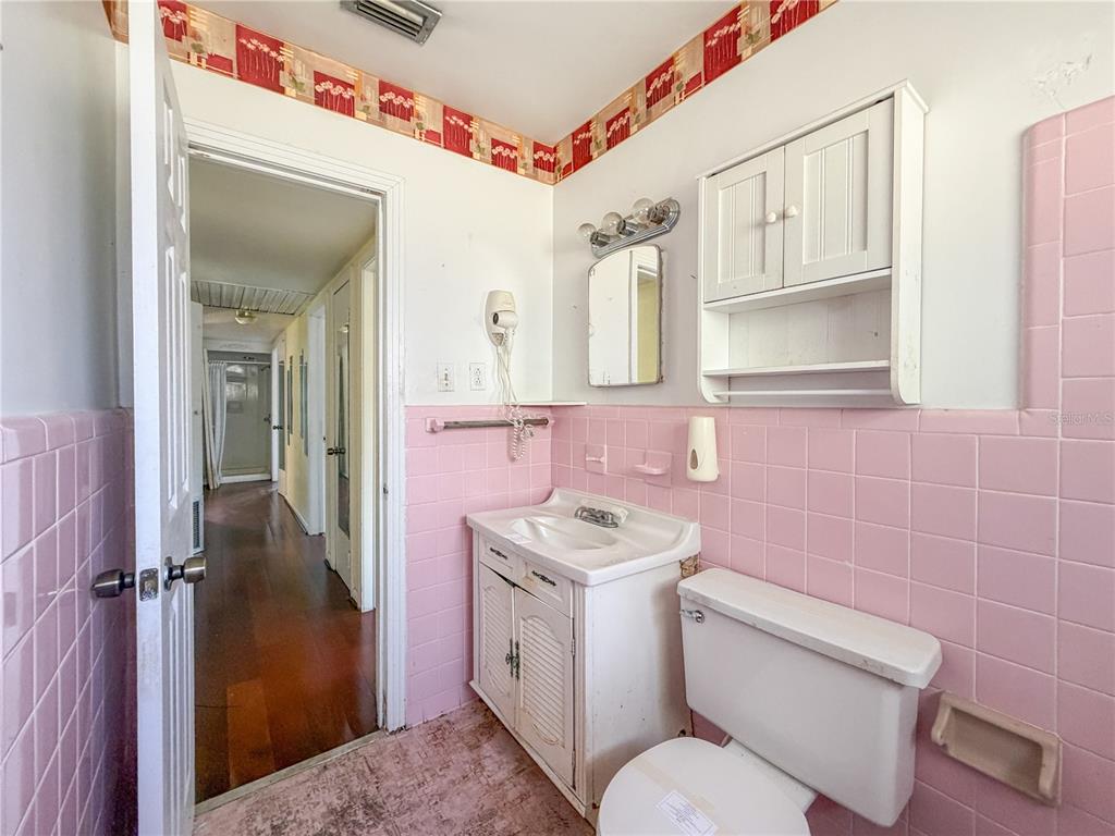 615 North Church Street Starke, FL 32091 - Photo 39 of 44 a bathroom with a sink toilet and shower
