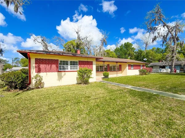 front view of a house with a big yard
