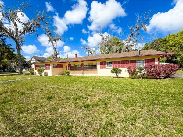 a front view of house with garden