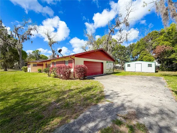 a view of a house with a big yard