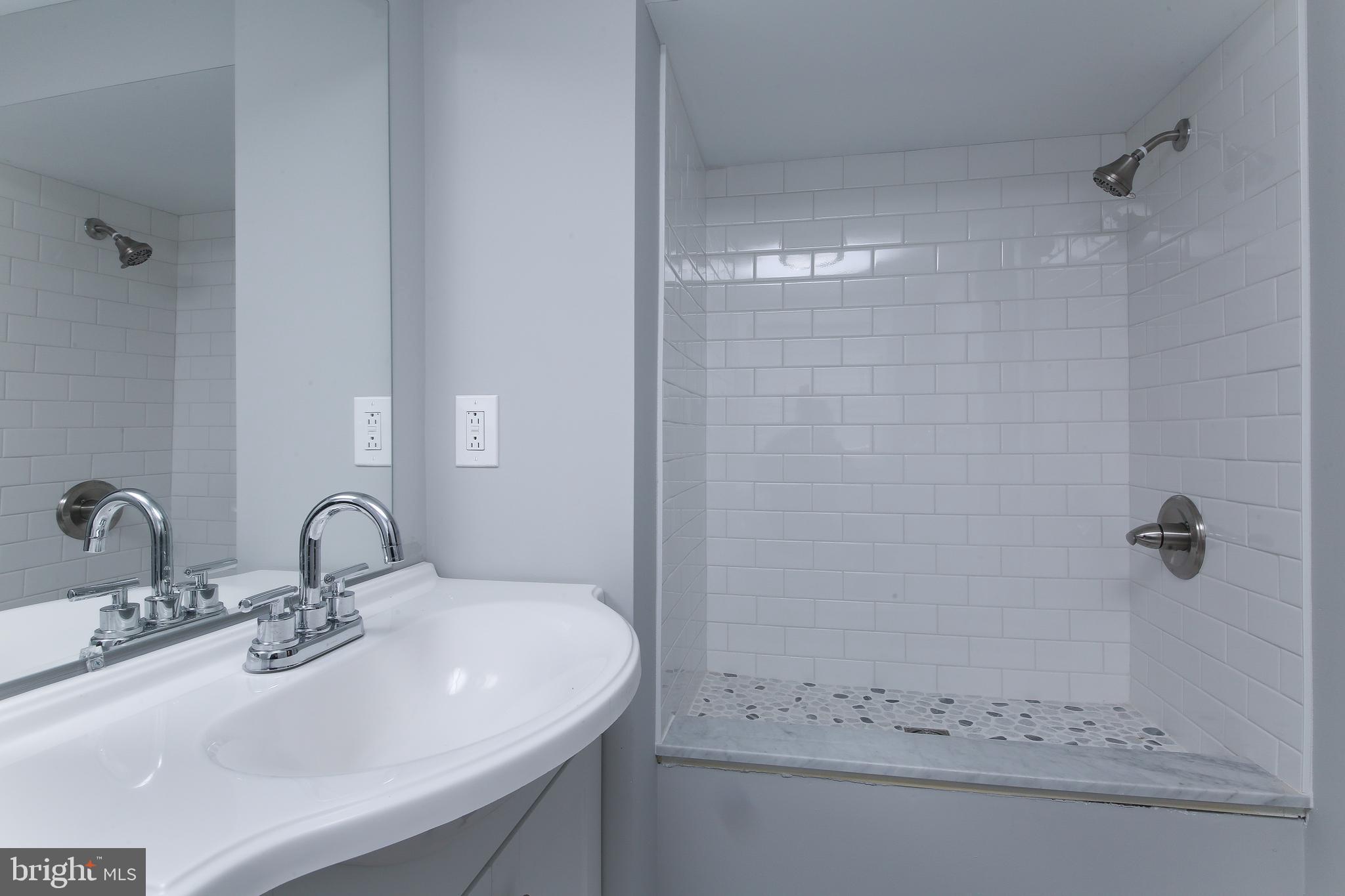 986 Coronet Road Warminster, PA 18974 - Photo 14 of 17 a bathroom with a sink and mirror