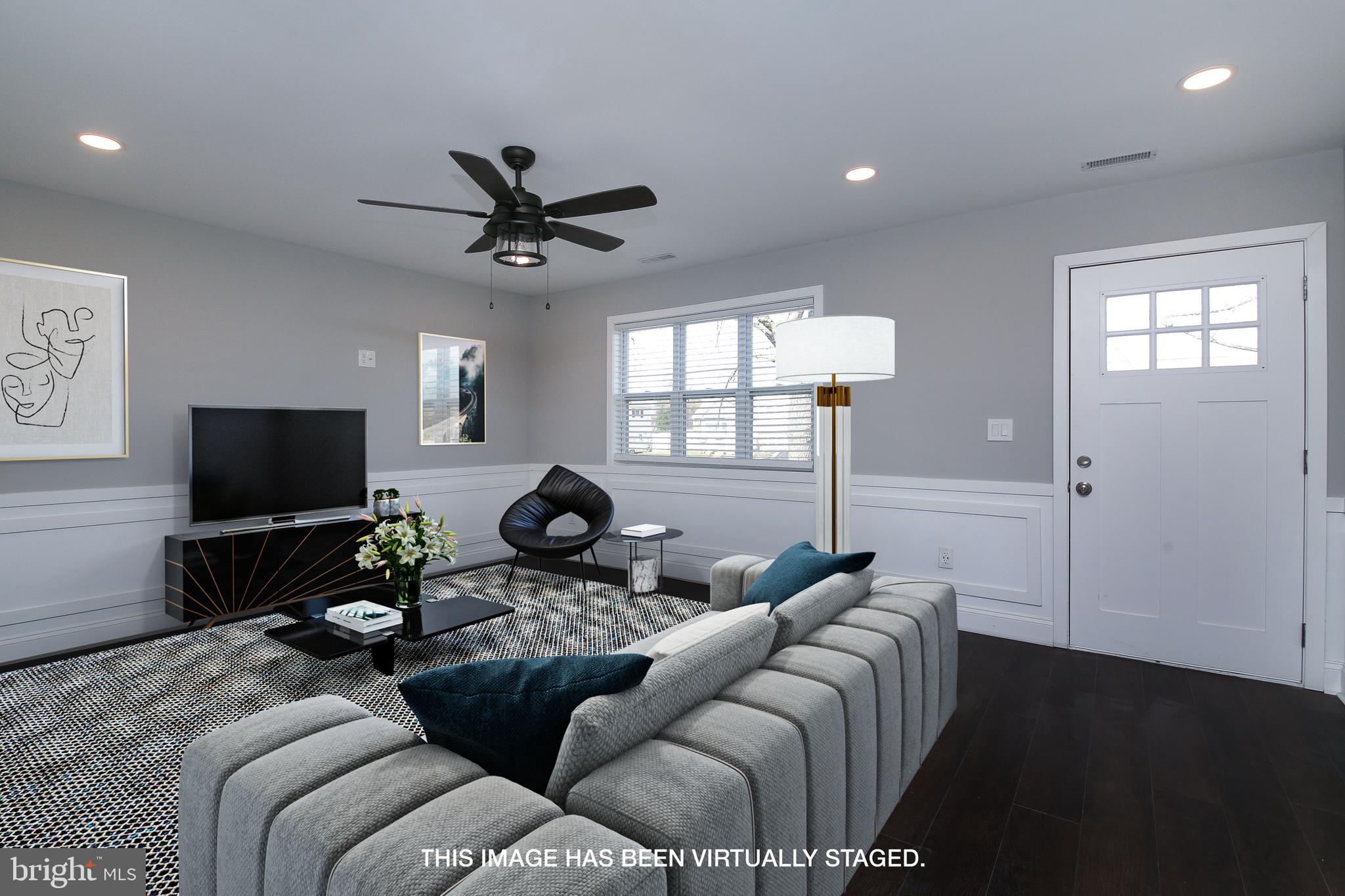 986 Coronet Road Warminster, PA 18974 - Photo 2 of 17 a living room with furniture and a flat screen tv