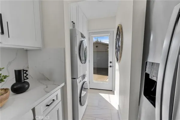 a kitchen with stainless steel appliances granite countertop a stove and a refrigerator