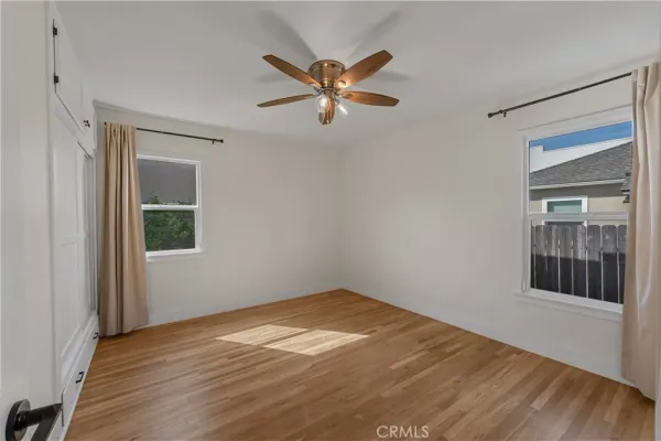 a view of a room with a ceiling fan