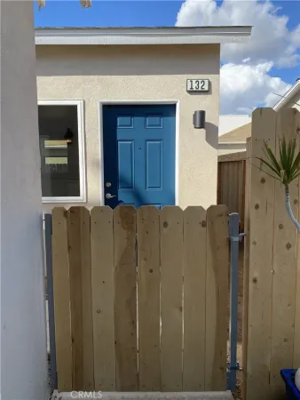 a kitchen with granite countertop white cabinets and stainless steel appliances