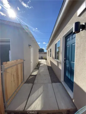 a kitchen with granite countertop a sink and a stove
