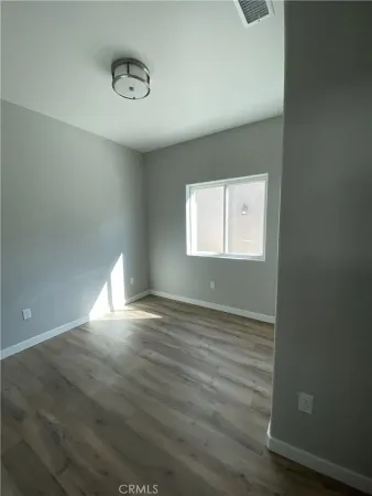 a view of an empty room and a window