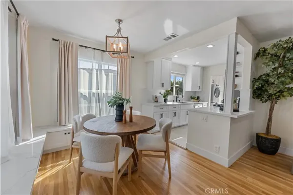a view of a dining room with furniture and window