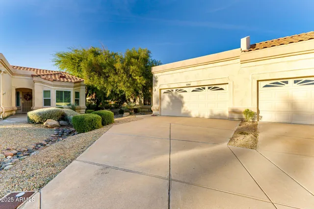 a view of a house with a backyard