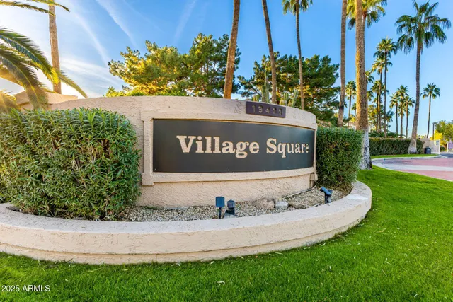 a view of a dining room with furniture wooden floor and a potted plant
