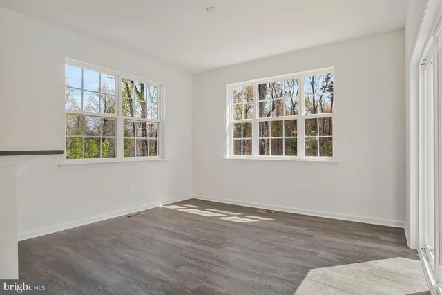 a view of empty room with windows