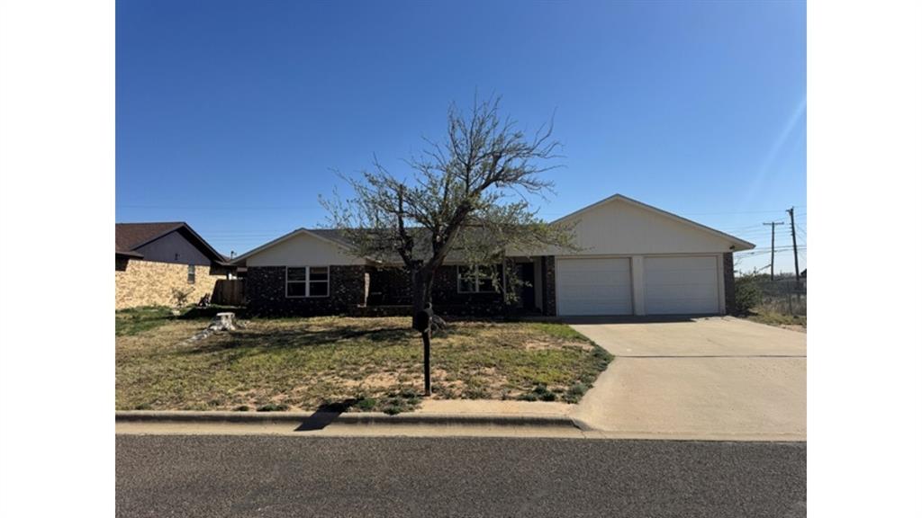 4004 Vicky Street Big Spring, TX 79720 - Photo 1 of 37 Ranch-style home with an attached garage, driveway, a front lawn, and brick siding