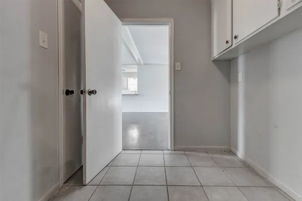 a view of an empty room and closet area