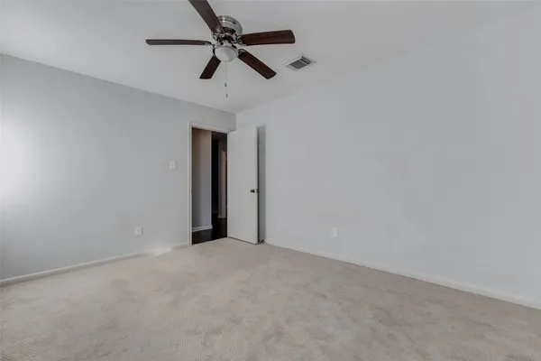 a view of a big room with carpet