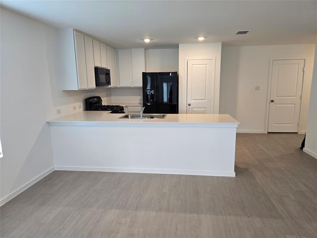 1165 Barbary Flds Street Forney, TX 75126 - Photo 11 of 24 a view of kitchen with wooden floor
