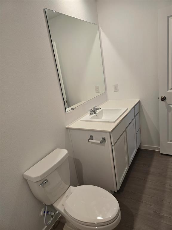 1165 Barbary Flds Street Forney, TX 75126 - Photo 14 of 24 a white toilet sitting next to a bathroom sink