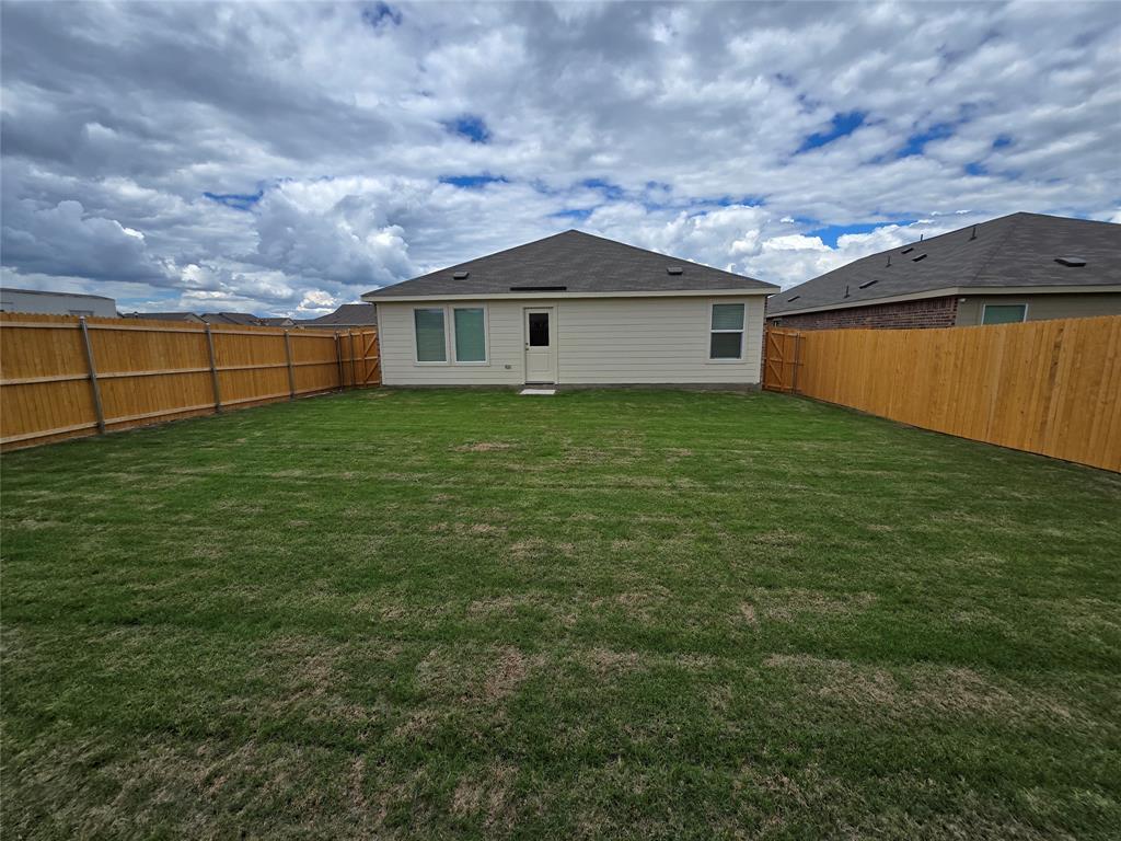 1165 Barbary Flds Street Forney, TX 75126 - Photo 2 of 24 a backyard of a house with lots of green space