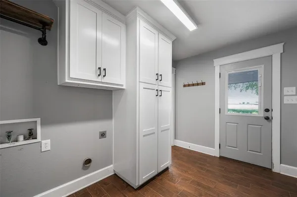 a bathroom with a granite countertop toilet sink and mirror