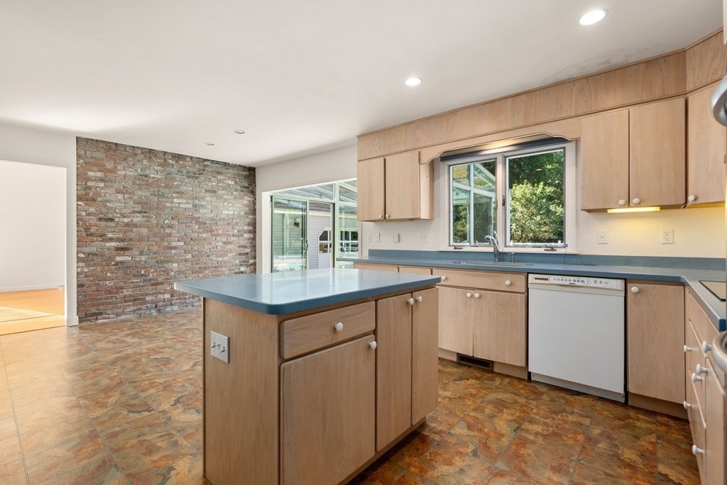 55 Westerly Road Weston, MA 02493 - Photo 11 of 30 a kitchen with stainless steel appliances granite countertop a granite counter tops and a window