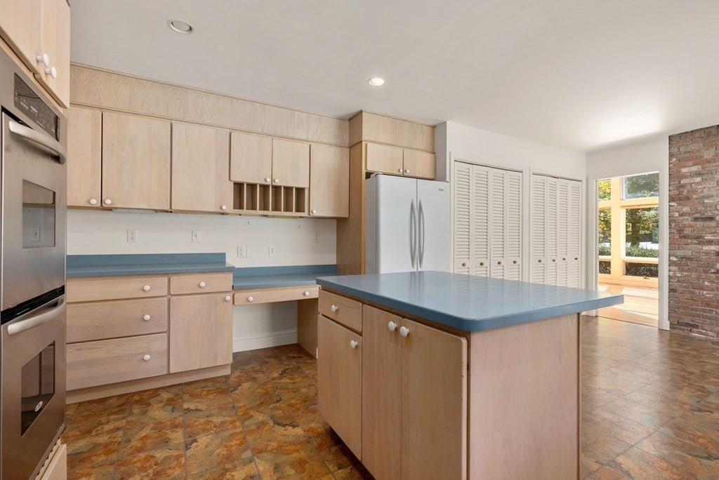 55 Westerly Road Weston, MA 02493 - Photo 12 of 30 a kitchen with a sink cabinets and wooden floor