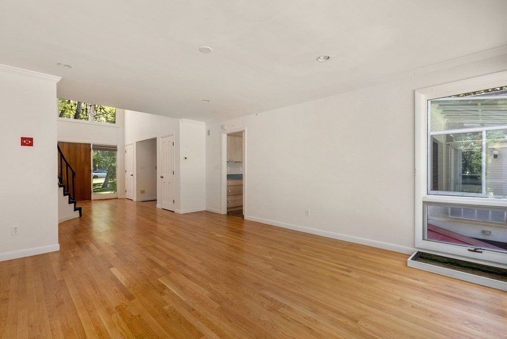 55 Westerly Road Weston, MA 02493 - Photo 8 of 30 a view of an empty room with wooden floor and closet
