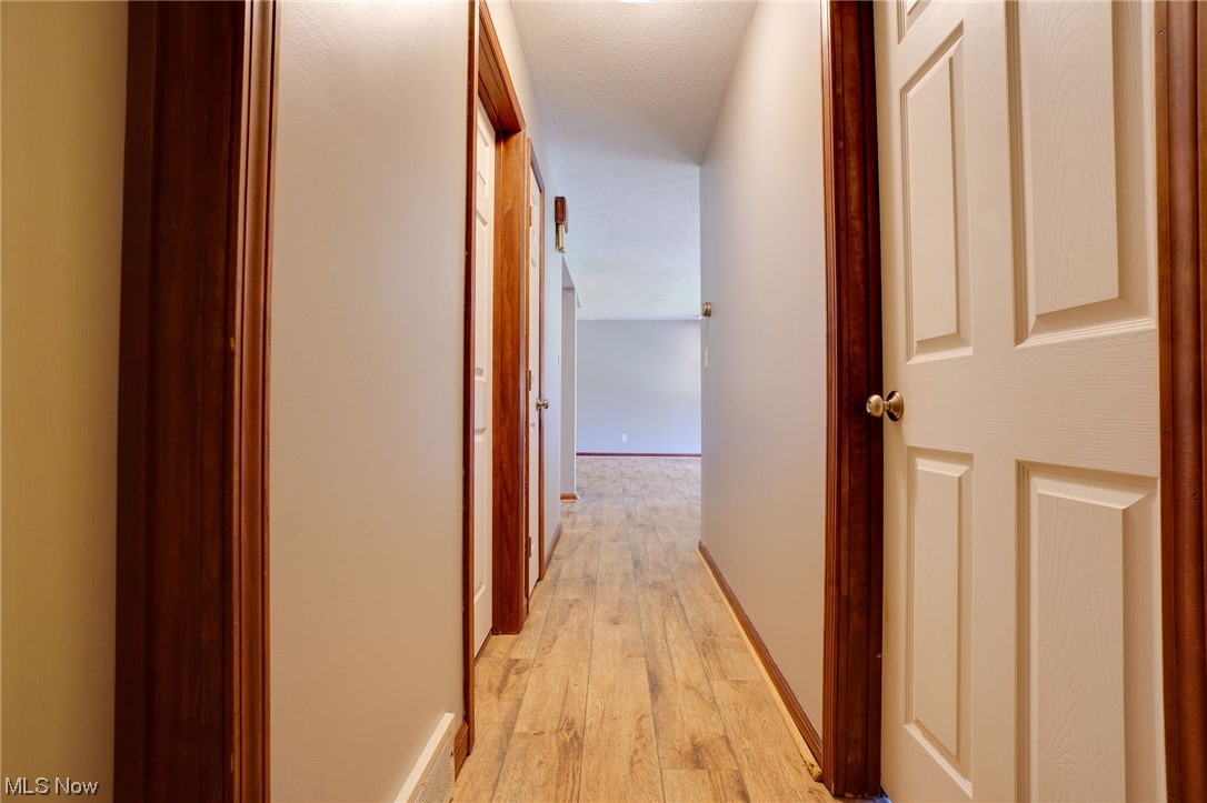6406 Liberty Road Solon, OH 44139 - Photo 25 of 35 Corridor featuring light hardwood floors