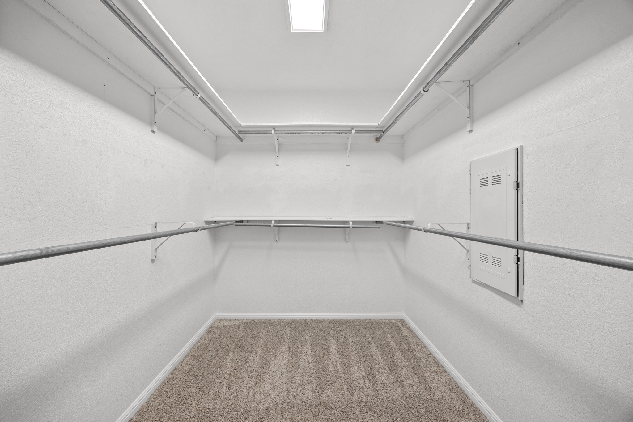 2413 Starhill Ranch Street Georgetown, TX 78628 - Photo 22 of 40 a view of a room with racks on the wall