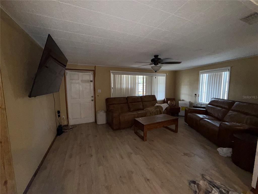 4530 Swinger Road Dover, FL 33527 - Photo 6 of 14 a living room with furniture and a flat screen tv