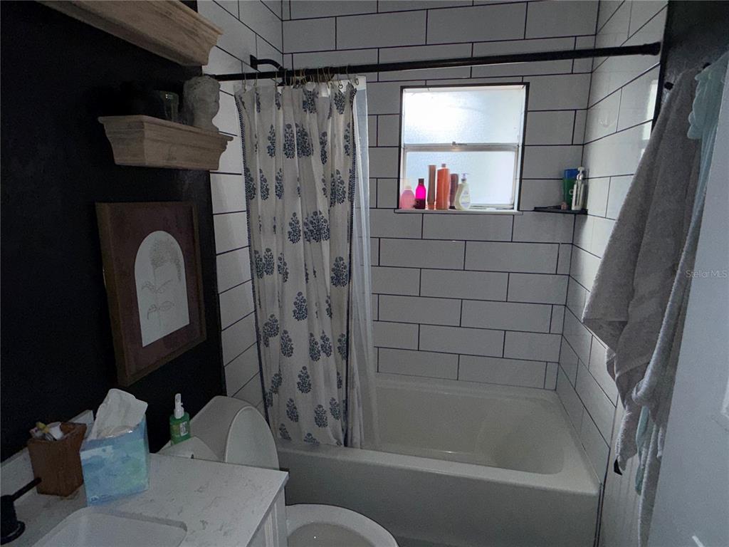 4530 Swinger Road Dover, FL 33527 - Photo 9 of 14 a bathroom with a shower a sink and a toilet